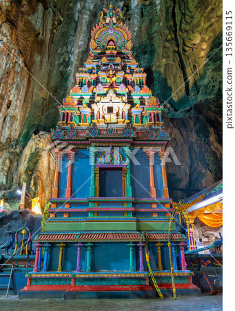 Ornate and colorful Hindu shrine nestled within the sacred Batu Caves, Kuala Lumpur Malaysia Ornate and colorful Hindu shrine nestled within the sacred Batu Caves, Kuala Lumpur Malaysia 135669115