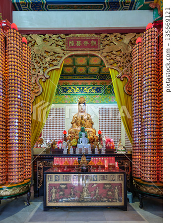Golden Guanyin statue on an ornate altar inside Thean Hou Temple, Kuala Lumpur, Malaysia Golden Guanyin statue on an ornate altar inside Thean Hou Temple, Kuala Lumpur, Malaysia 135669121