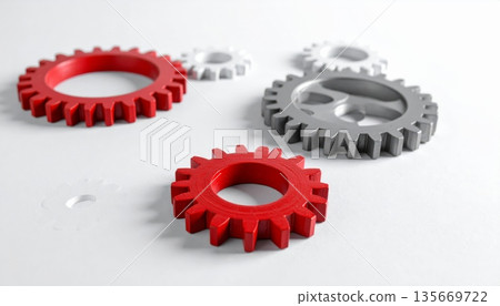 3D industrial concept of red gear wheels and cogs on white background representing mechanical engineering connection and business teamwork in a modern steel machinery mechanism 135669722
