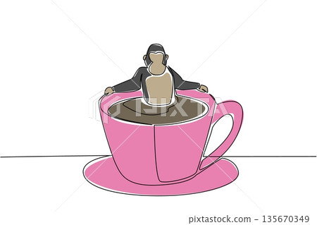 Continuous line drawing of strong playful animal shows grey gorilla soaking in coffee cup for nature concept. Colorful art is perfect for an international coffee day theme with an adorable ape 135670349