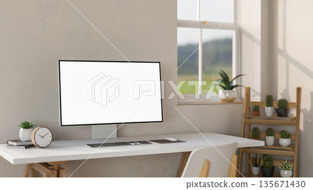 Blank screen computer aside clock and potted plant on white table aside wooden display shelf. Blank screen computer aside clock and potted plant on white table aside wooden display shelf. 135671430