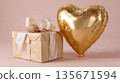 Elegant gold gift box with heart balloon on soft pink background 135671594