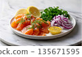 Fresh salmon with lemon, dill, red onion, and mustard dressing on white plate 135671595
