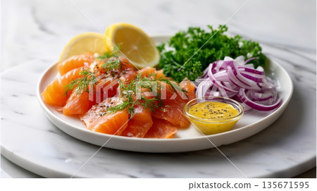 Fresh salmon with lemon, dill, red onion, and mustard dressing on white plate 135671595