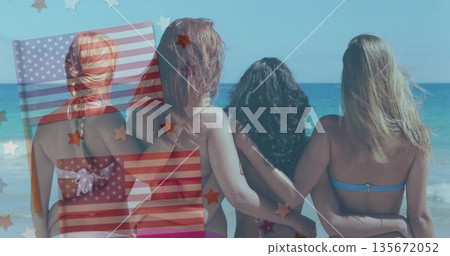 Standing four women linking arms on sandy beach by sea, with colorful bikinis, star stripe graphics Standing four women linking arms on sandy beach by sea, with colorful bikinis, star stripe graphics 135672052