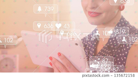Smiling woman in navy blouse holding tablet beside desk clock, with floating media notifications Smiling woman in navy blouse holding tablet beside desk clock, with floating media notifications 135672158