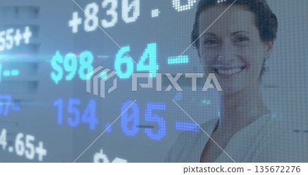 Smiling financial analyst standing in trading room, with translucent stock data panel, copy space 135672276