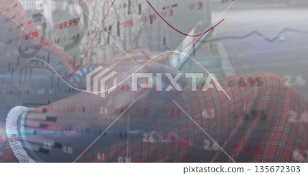 Scrolling mature man checking overlaid market graphs on smartphone on sidewalk wearing plaid pants Scrolling mature man checking overlaid market graphs on smartphone on sidewalk wearing plaid pants 135672303