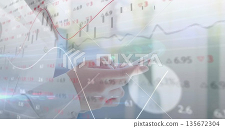Tapping smartphone, Asian woman's hands wearing blouse in office, with financial chart overlays 135672304