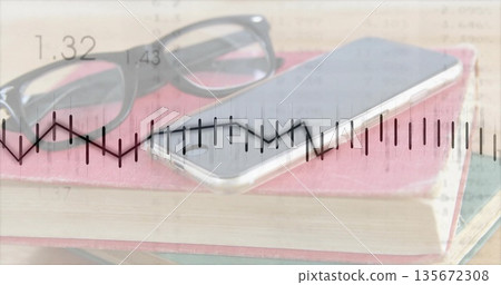 Showing study desk holding red hardcover book, eyeglasses and smartphone, data overlay, copy space 135672308