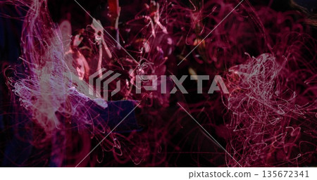 Dancing neon light trails weaving through dark space, with vibrant abstract light streak patterns 135672341