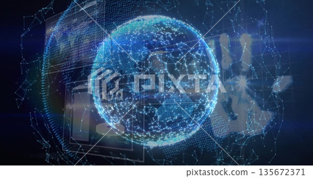 Floating holographic globe rotating in virtual data space, with network mesh and hand silhouette 135672371