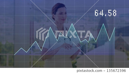 Doctor wearing lab coat holding tablet and stethoscope in clinic, analyzing data with 64 Doctor wearing lab coat holding tablet and stethoscope in clinic, analyzing data with 64 135672396