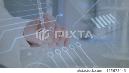 Analyzing male scientist in lab coat handling glass pipette on lab bench, circuit data overlay 135672443