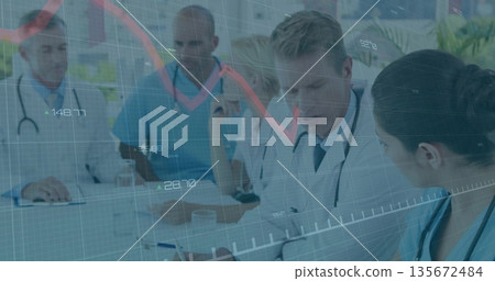 Middle-aged doctor in coat writing notes at hospital meeting room with stethoscope and data overlay 135672484