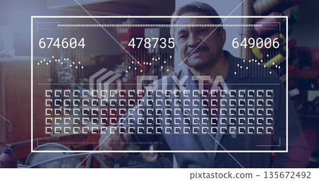 Examining overlay showing data while holding tool in repair workshop, featuring bicycle rim 135672492