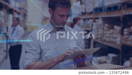 Operating tablet adult man interacting at storage aisle with metal shelving, boxes on pallets Operating tablet adult man interacting at storage aisle with metal shelving, boxes on pallets 135672496