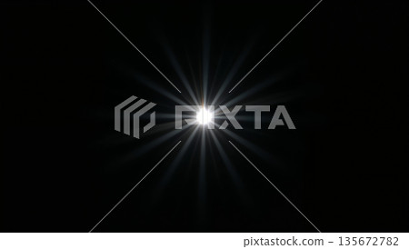 Bright starburst light effect with lens flare on a black background 135672782