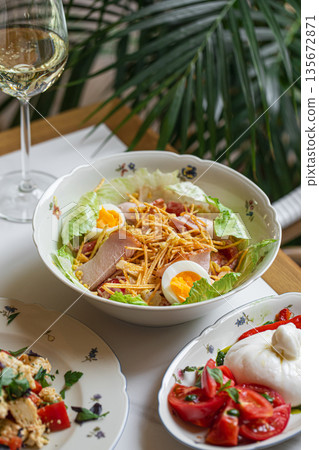 Capercaillie nest salad served with wine Capercaillie nest salad served with wine 135672871