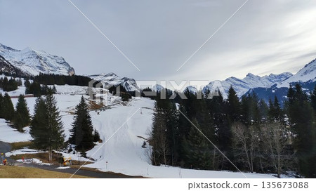Interlaken, Switzerland - March 18 2023: Surrounding View of Mountanious Interlaken Interlaken, Switzerland - March 18 2023: Surrounding View of Mountanious Interlaken 135673088