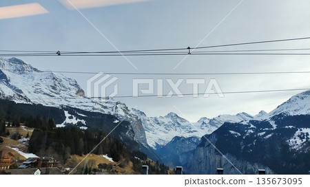 Interlaken,  Switzerland - March 18 2023: Surrounding View of Mountanious Interlaken 135673095