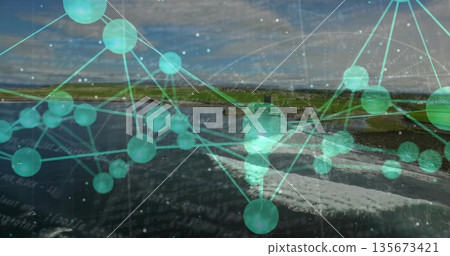 Overlaying turquoise network spanning rugged coast, with grassy cliffs and medieval tower ruin 135673421
