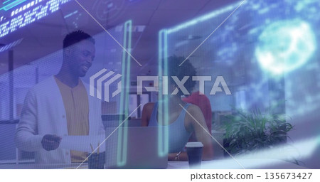 Collaborating coworkers analyzing holographic code interface in office with laptop, copy space 135673427