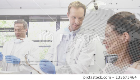 Three researchers wearing lab coats conducting tests at lab, with pipette and digital globe overlay Three researchers wearing lab coats conducting tests at lab, with pipette and digital globe overlay 135673464