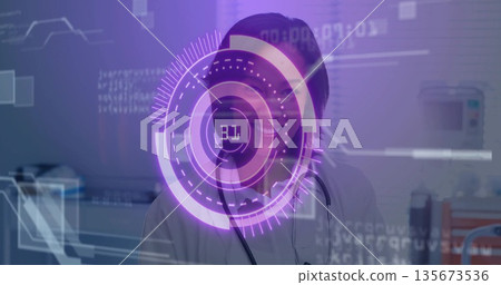 Interacting female doctor wearing white coat with stethoscope, using purple AR display in clinic 135673536