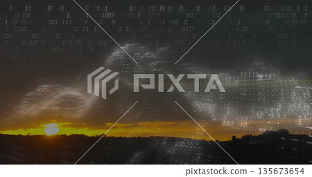 Streaming binary code wave forming data overlay across rural dusk sky, with sun glow over hills 135673654