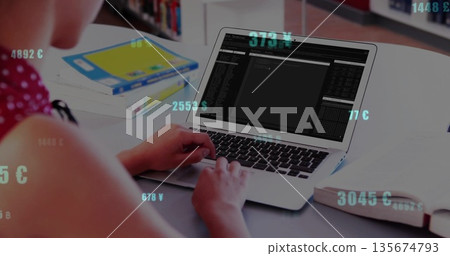 Typing teenager wearing red polka-dot top using laptop in study room, with floating currency values Typing teenager wearing red polka-dot top using laptop in study room, with floating currency values 135674793