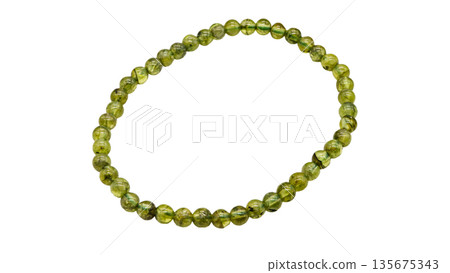 Peridot natural stone bracelet macro photography white background Peridot natural stone bracelet macro photography white background 135675343