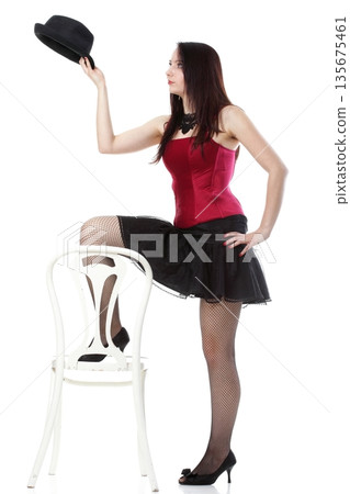showgirl woman dance in red corset chair white isolated 135675461