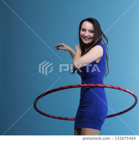 Dance hoop Beautiful woman in blue Dance hoop Beautiful woman in blue 135675484
