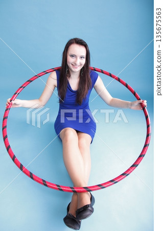 Dance hoop Beautiful woman in blue Dance hoop Beautiful woman in blue 135675563