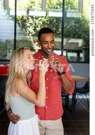 Celebrating joyful moment, couple toasting with champagne together at home 135675845
