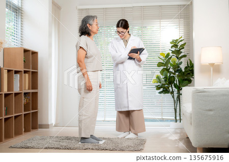 Asian woman doctor checkup patient senior for medical health. 135675916