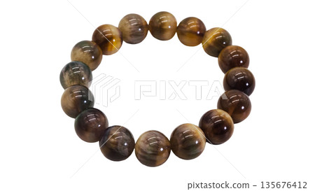 Tiger's eye bracelet, macro shot, white background 135676412