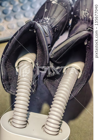 Electric boot and shoe dryer with ski boots. Electric boot and shoe dryer with ski boots. 135677040