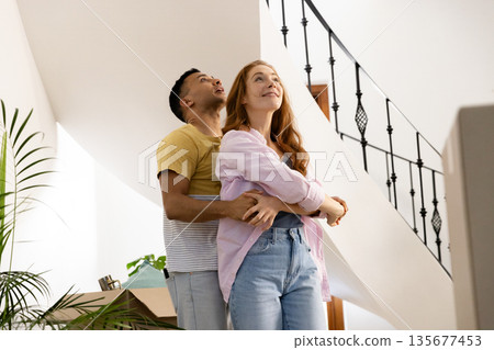 Embracing at home, couple sharing peaceful moment together, feeling content 135677453