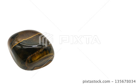 Macro photography of raw tiger eye stone on white background Macro photography of raw tiger eye stone on white background 135678034