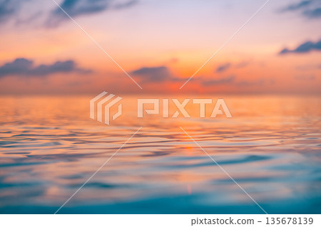 Inspirational sunrise and sunset over ocean view with calm water surface, tranquil horizon, and dreamy sky clouds creating a peaceful tropical nature background for travel, vacation, and lifestyle des Inspirational sunrise and sunset over ocean view with calm water surface, tranquil horizon, and dreamy sky clouds creating a peaceful tropical nature background for travel, vacation, and lifestyle des 135678139