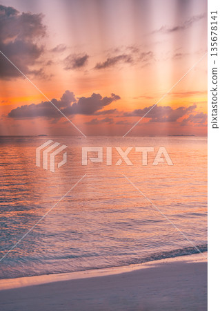 Tranquil summer sunset at tropical beach with blurred palm leaves framing peaceful ocean view, creating an inspiring nature background for travel, vacation, and lifestyle design Tranquil summer sunset at tropical beach with blurred palm leaves framing peaceful ocean view, creating an inspiring nature background for travel, vacation, and lifestyle design 135678141