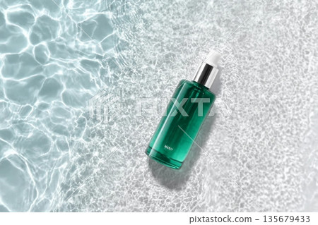 Cosmetic bottle on the water surface. Blank label for branding mock-up. Summer water pool fresh concept. Flat lay, top view. 135679433