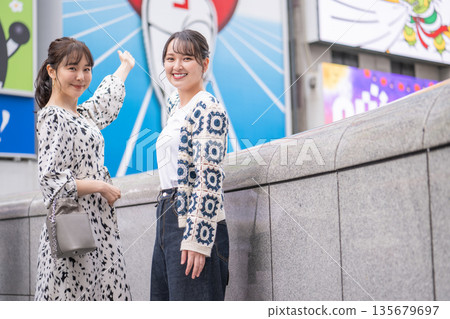 Two women sightseeing in Osaka 135679697