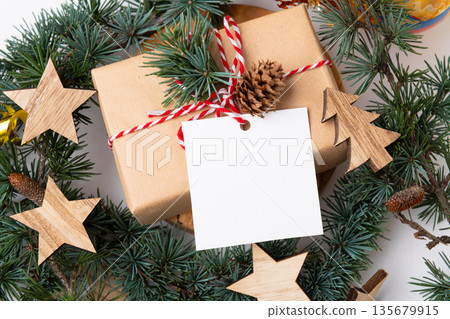 Christmas square gift tag mockup with present box on white background 135679915