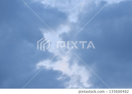 dark cloud spreading on twilight sunset sky in evening dark cloud spreading on twilight sunset sky in evening 135680482