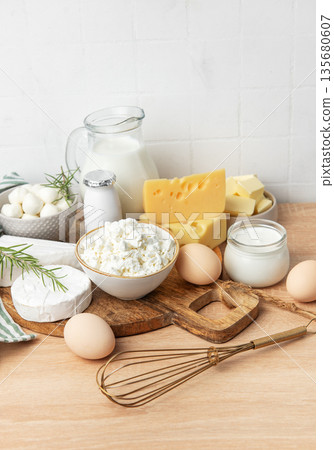 Assortment of fresh dairy products and eggs on wood Assortment of fresh dairy products and eggs on wood 135680607