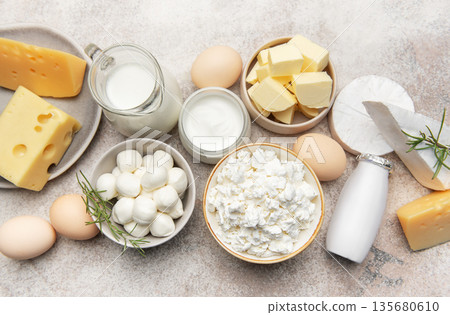 Dairy products assortment showcasing fresh milk cheese butter eggs Dairy products assortment showcasing fresh milk cheese butter eggs 135680610