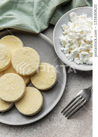 Frozen cottage cheese pancakes ready for cooking 135680620